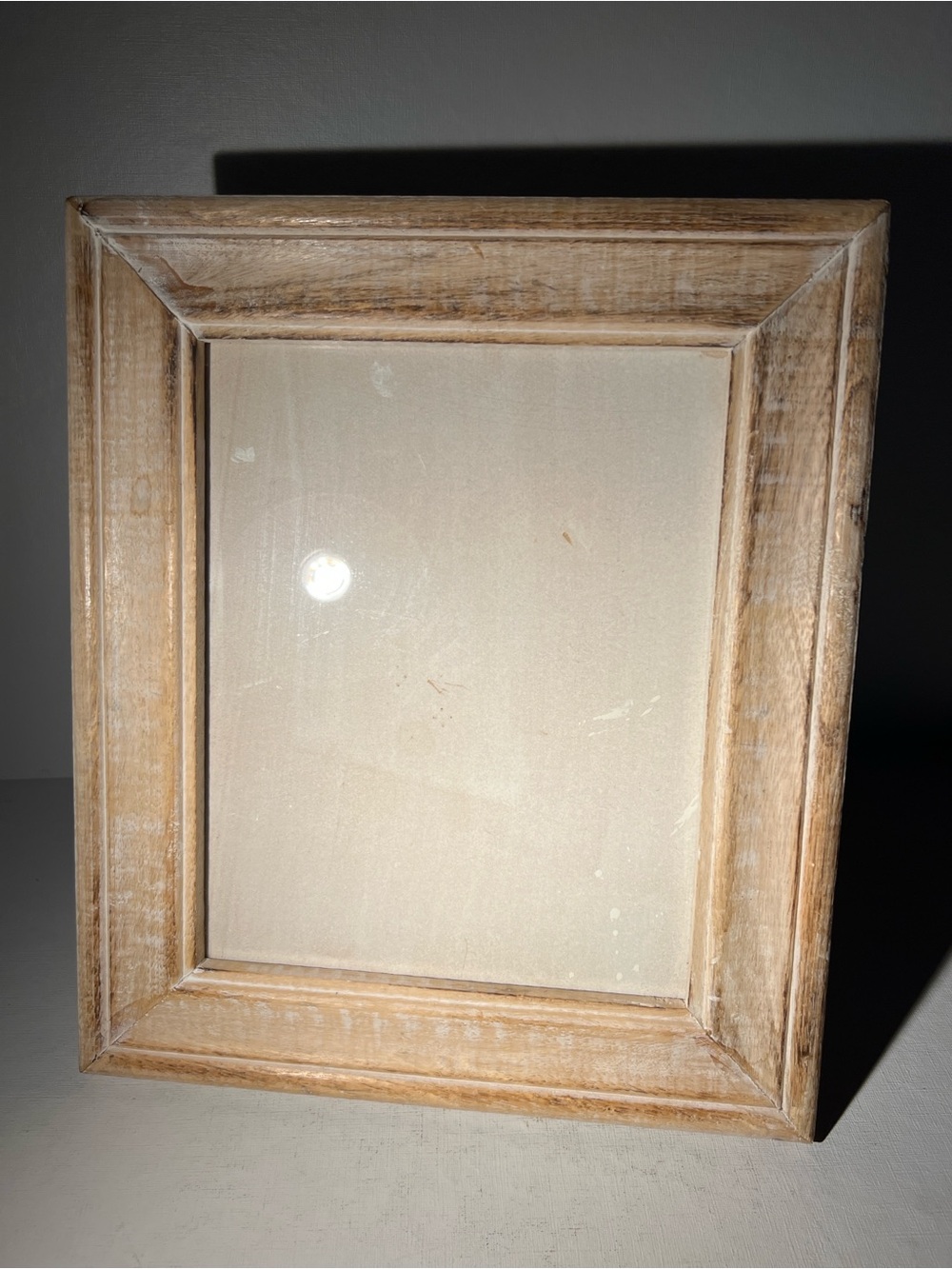 Rustic distressed wood picture frame with farmhouse style finish.